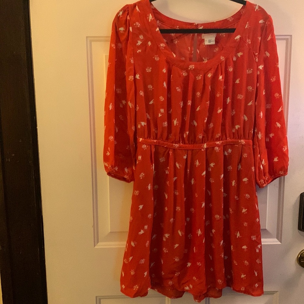 Red orange boutique dress with white print and pockets. New with tags. Size L